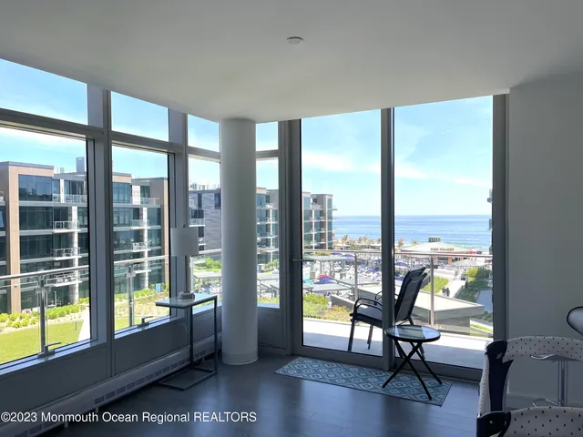 a bedroom with a large bed and a large window