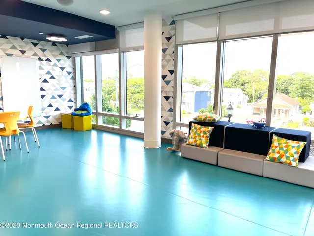 a room with gym equipment and a large window