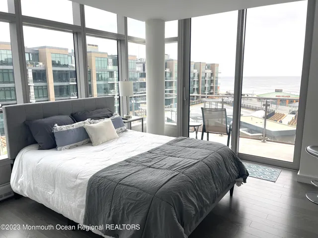 a view of a dining room with furniture and window
