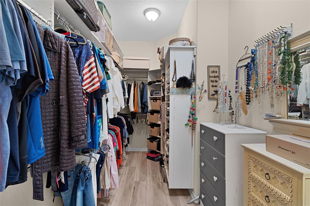 2211 Bachman Path The Villages, FL 32162 - Photo 29 of 60 a view of walk in closet with clothes and shoes