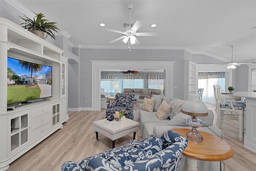 2211 Bachman Path The Villages, FL 32162 - Photo 5 of 60 a living room with furniture and a flat screen tv