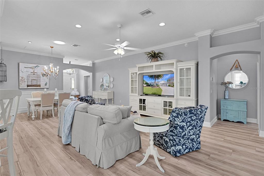 2211 Bachman Path The Villages, FL 32162 - Photo 6 of 60 a living room with furniture and a wooden floor