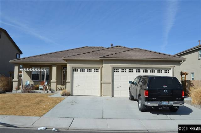 10825 Dancing Aspen Drive Reno, NV 89521 - Photo 1 of 1 a view of a car park in front of house