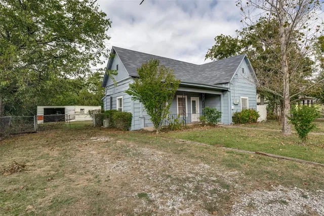 a house view with a garden space