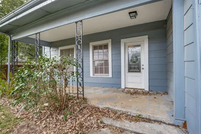 wooden floor that has a window and a wooden floor