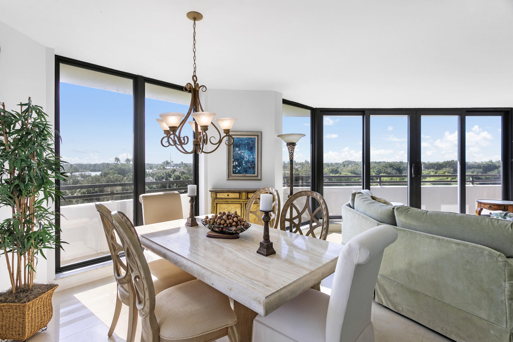 3322 Casseekey Island Road, Unit 504 Jupiter, FL 33477 - Photo 9 of 46 a view of a dining room with furniture window and outside view
