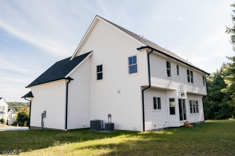 4 Hemlock Circle Warren, NJ 07059 - Photo 13 of 28 a view of a white house with yard and sitting area