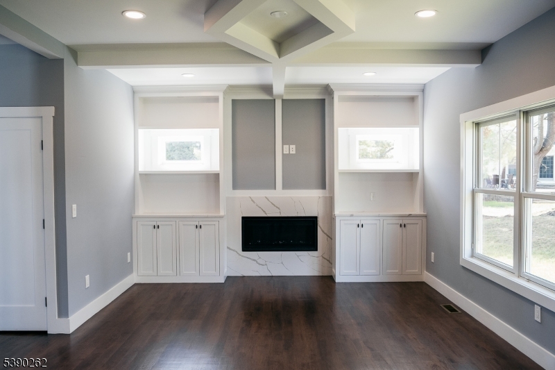 4 Hemlock Circle Warren, NJ 07059 - Photo 15 of 28 a living room with a fireplace and wooden floor