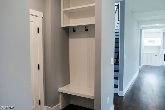 a view of hallway with wooden floor