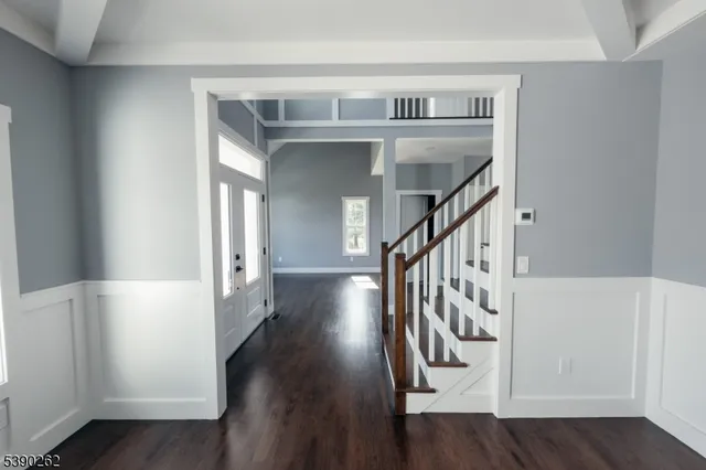 a view of entryway with wooden floor
