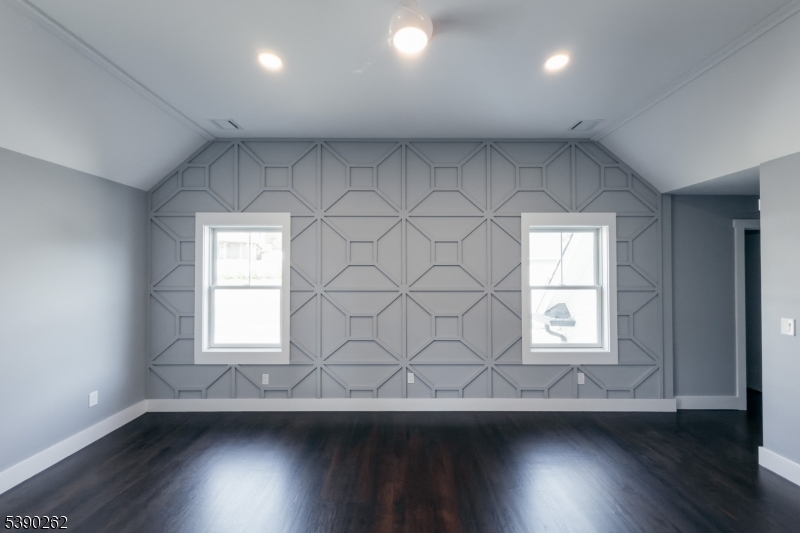 4 Hemlock Circle Warren, NJ 07059 - Photo 23 of 28 an empty room with wooden floor and windows