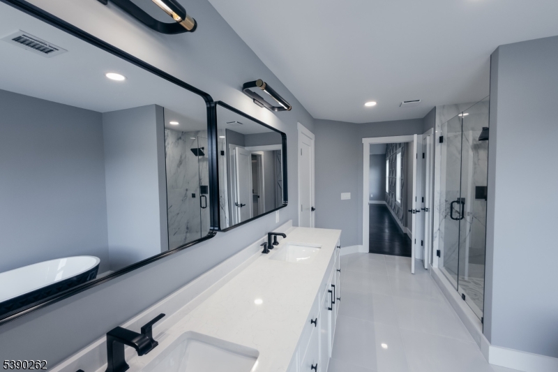 4 Hemlock Circle Warren, NJ 07059 - Photo 26 of 28 a bathroom with a sink a toilet and shower