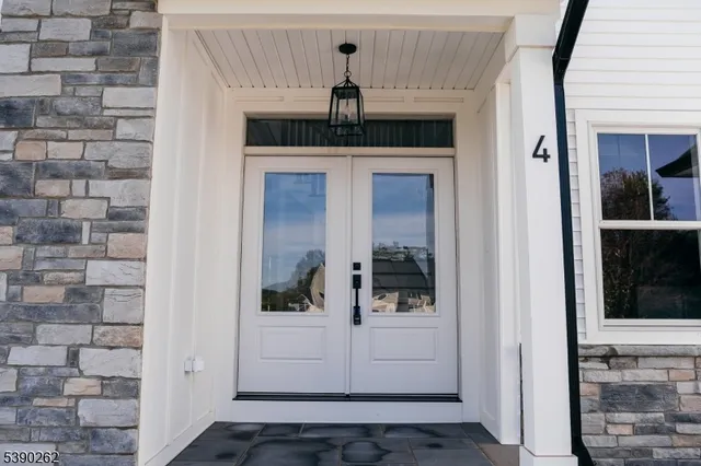 a view of a hallway with a chandelier