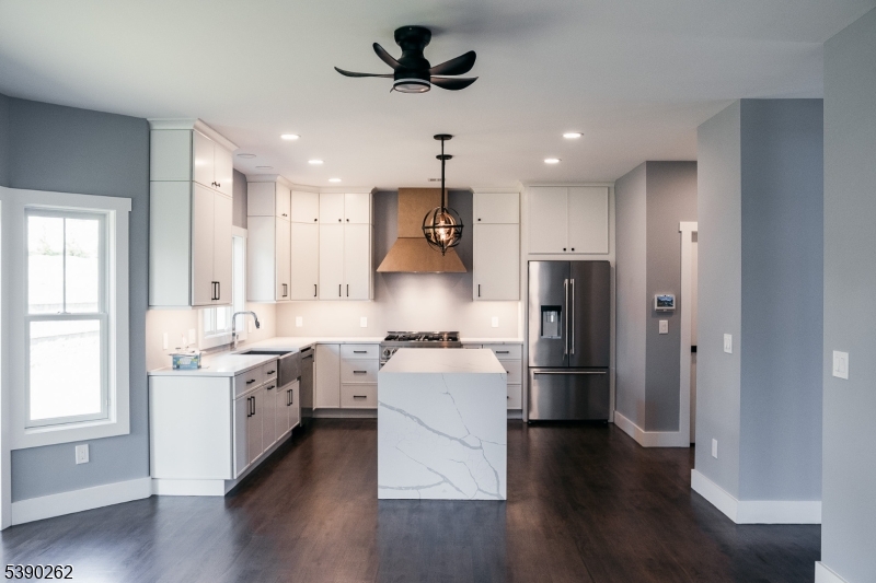 4 Hemlock Circle Warren, NJ 07059 - Photo 4 of 28 a kitchen with stainless steel appliances kitchen island granite countertop a stove a refrigerator and a sink