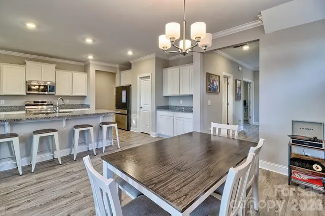a kitchen with stainless steel appliances granite countertop a sink and cabinets