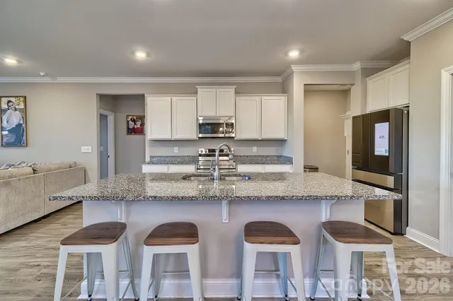 a view of a kitchen and dining room