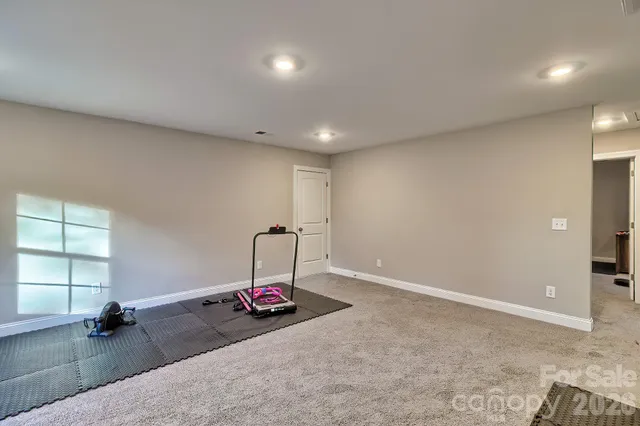 a view of a big room with windows and cabinet