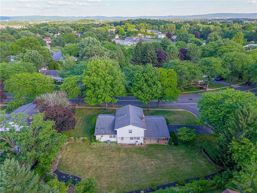 5425 Clauser Road Orefield, PA 18069 - Photo 18 of 18 Discover a tranquil suburban oasis, framed by mature trees and offering a private yard experience.