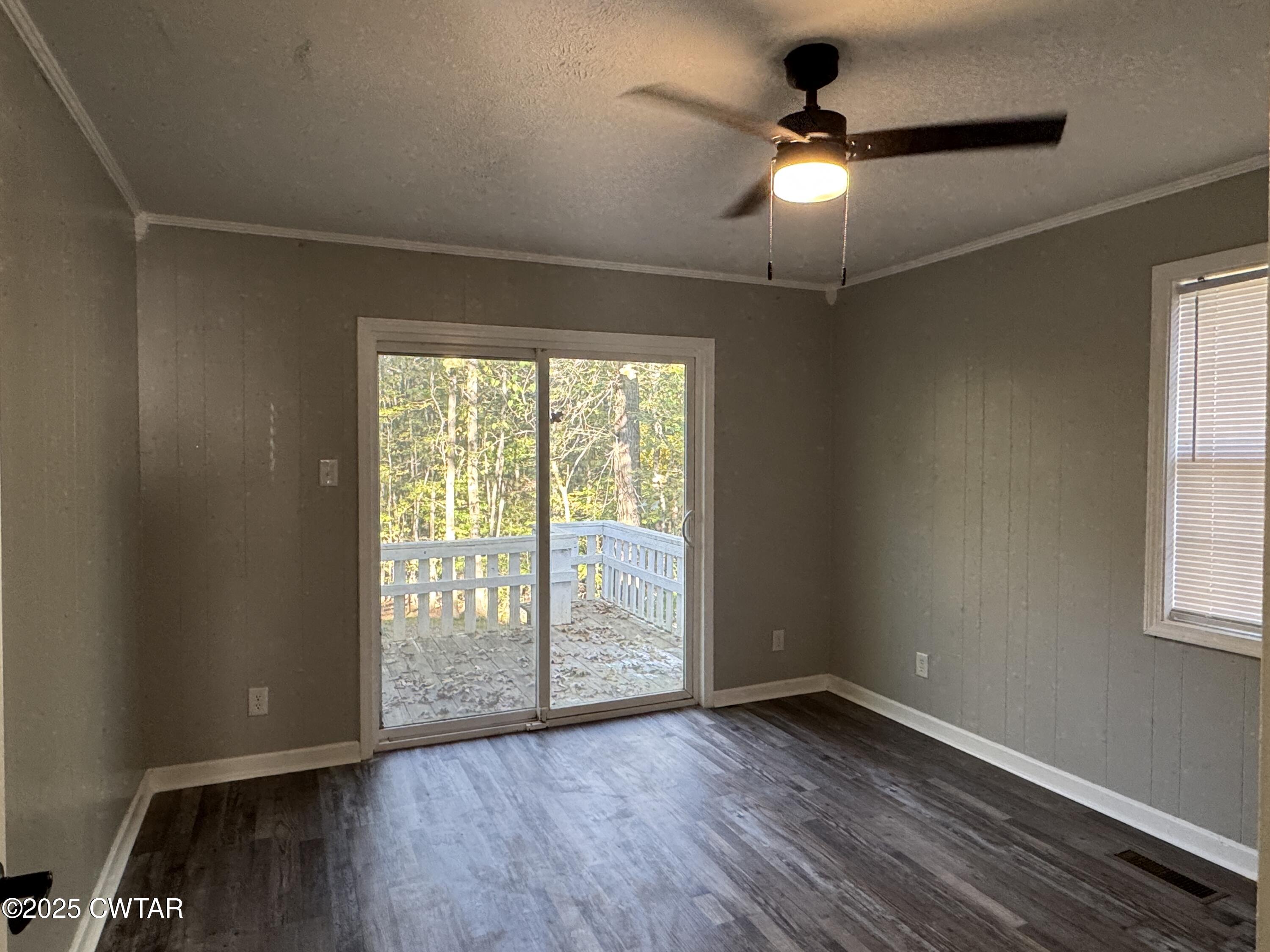 380 Patterson Lane Finger, TN 38334 - Photo 12 of 25 wooden floor in an empty room with a window