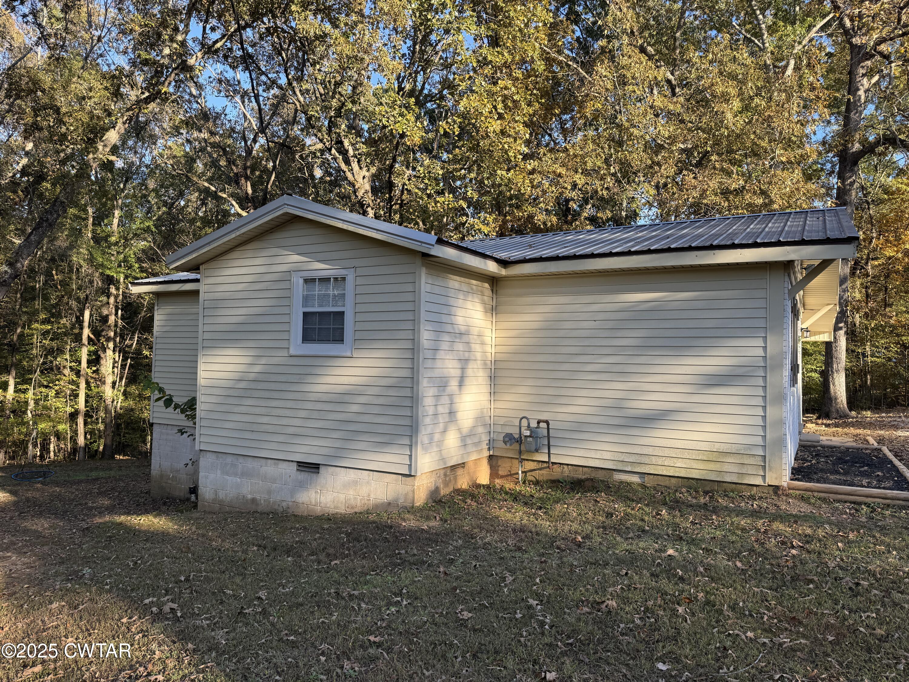 380 Patterson Lane Finger, TN 38334 - Photo 6 of 25 a view of a house with a yard