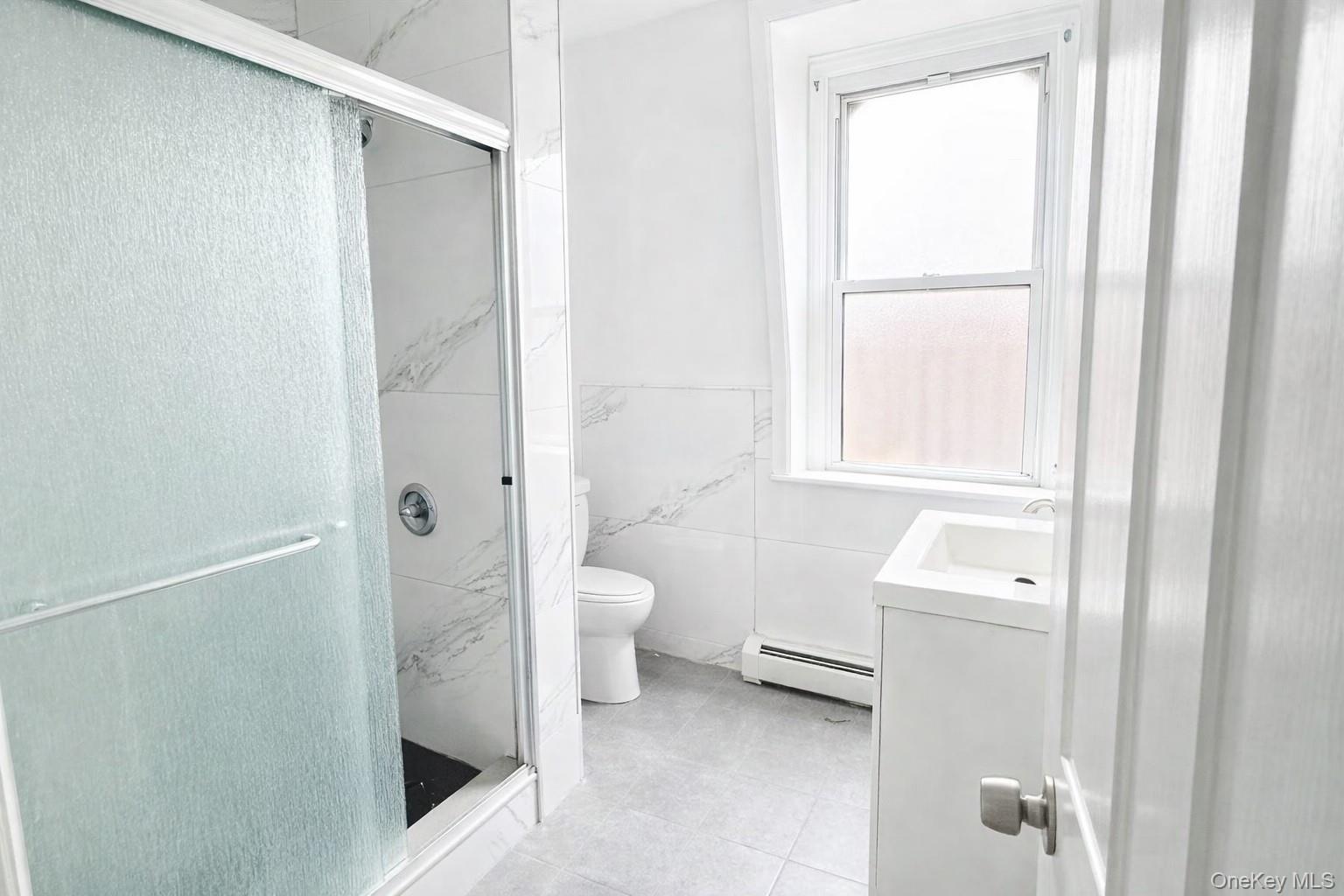 296 Mill Street Poughkeepsie, NY 12601 - Photo 15 of 19 a bathroom with a toilet sink and a mirror