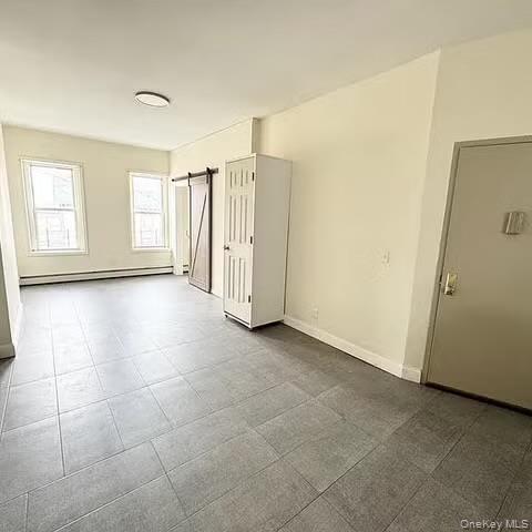 296 Mill Street Poughkeepsie, NY 12601 - Photo 8 of 19 a view of a livingroom with an empty space and a window