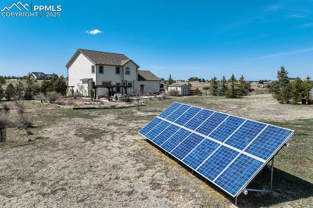 17825 Pinon Park Road Peyton, CO 80831 - Photo 2 of 5 Solar panels are paid off. Home Solar Power System is a Grid-tied Net-Metering 4.65 kWp with 16 210-watt ground mounted solar panels. This system produces 450-600 Kwh of electricity a month.
Providing greater than 48% of the Average 4-person household’s (El Paso County) monthly electric consumption of 925 Kwh. This system is Owner owned and will be transferred to new home buyers; providing years of reduced electric bills.