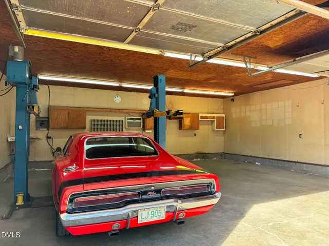 a bedroom with bed and window