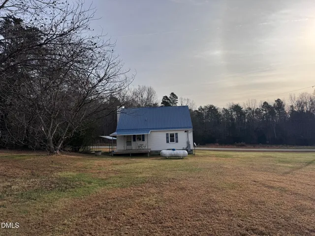 a house with trees in front of it