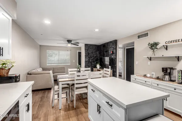 a kitchen with a table chairs and a stove