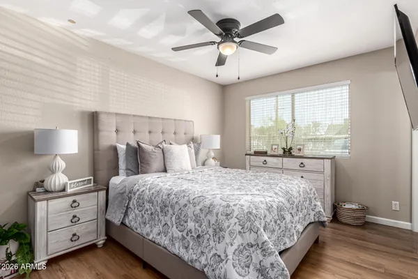 a bedroom with a large bed and a window