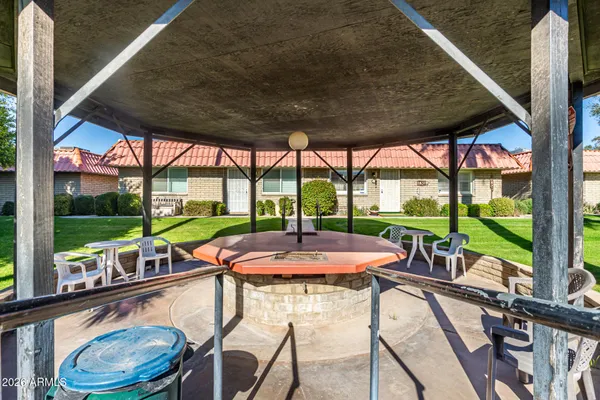 a view of a patio with a table chairs and a patio