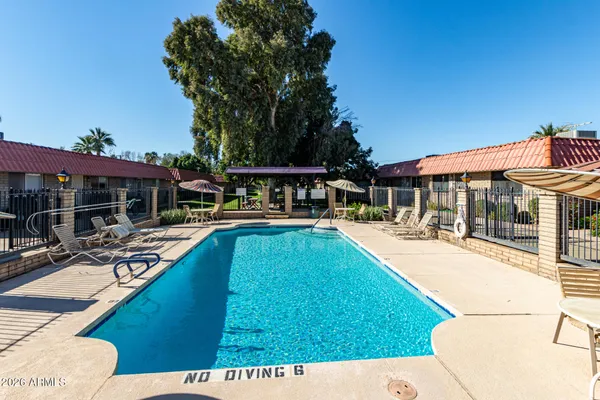 a view of a house with swimming pool