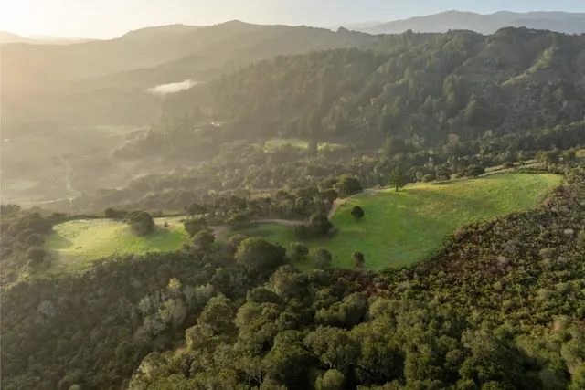 a view of a town with mountains in the background