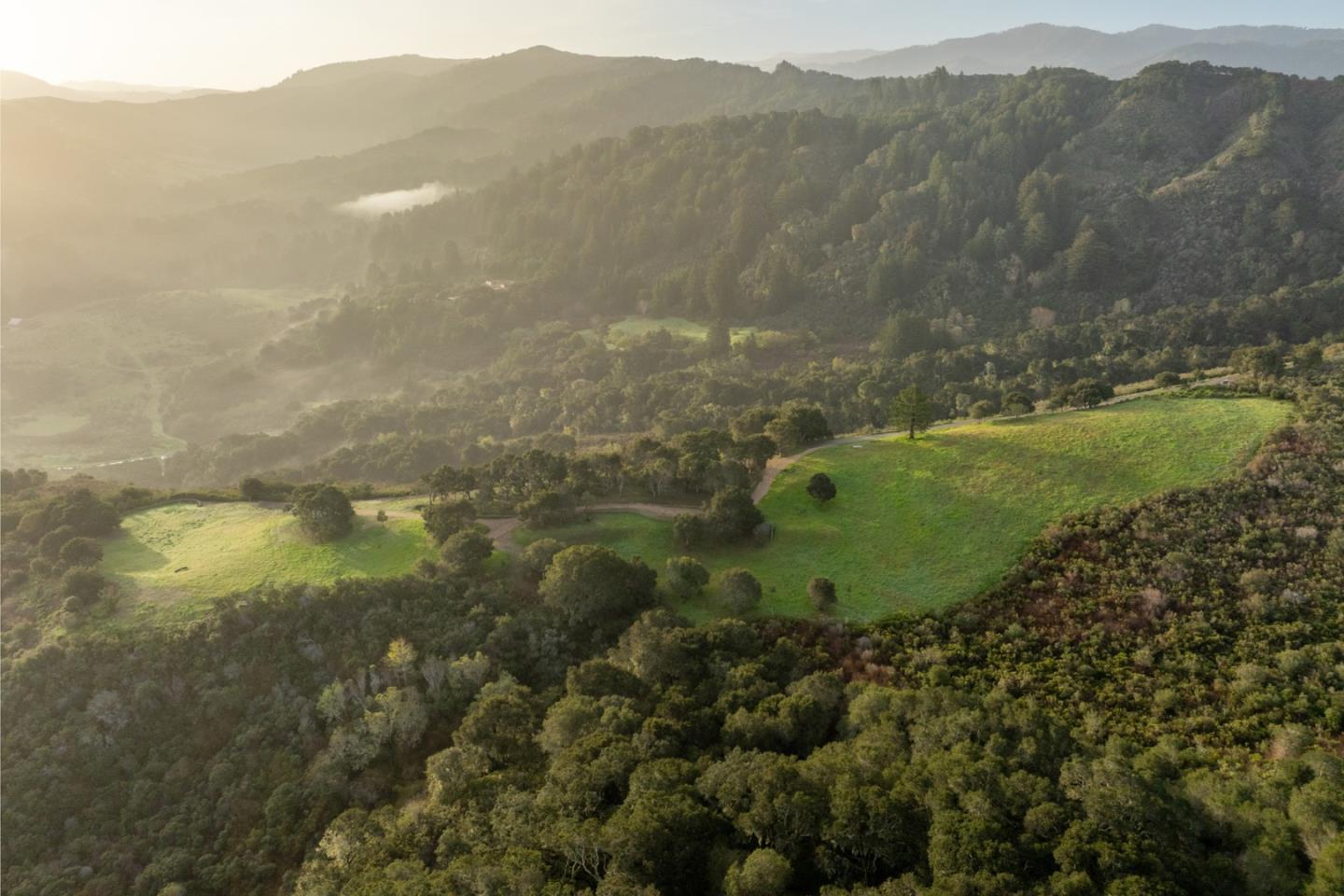 17 Rancho San Carlos Road Carmel, CA 93923 - Photo 2 of 24 a view of a lake with a mountain