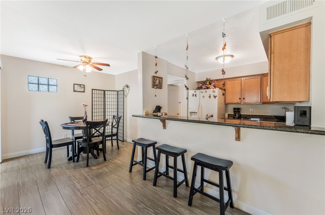 3145 East Flamingo Road, Unit 1092 Las Vegas, NV 89121 - Photo 6 of 33 Functional kitchen and dining area with durable flooring, ideal for casual meals and entertaining.