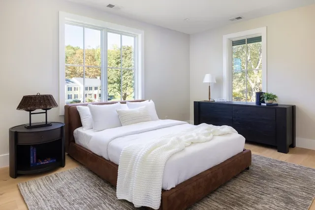 a bedroom with bed and window