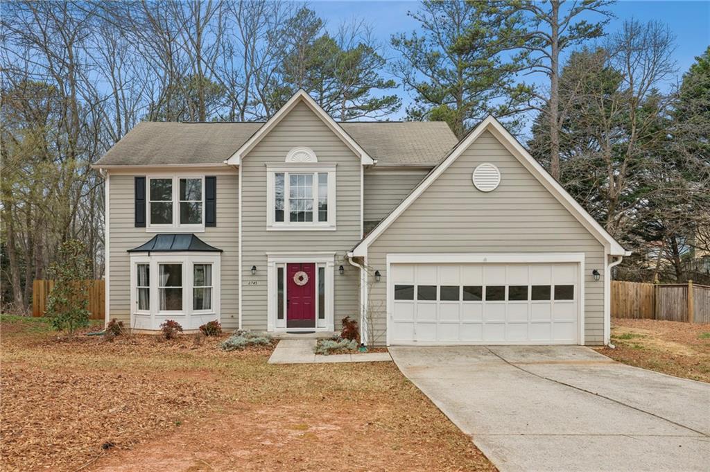 2745 Gravitt Road Northwest Duluth, GA 30096 - Photo 1 of 1 a view of a house with a yard