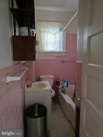 a room with furniture toys and a window