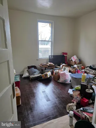 a bedroom with a bed and a mirror