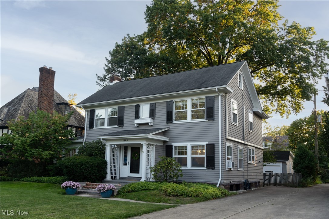 2890 Huntington Road Cleveland, OH 44120 - Photo 2 of 41 Colonial home featuring a front yard and cooling unit