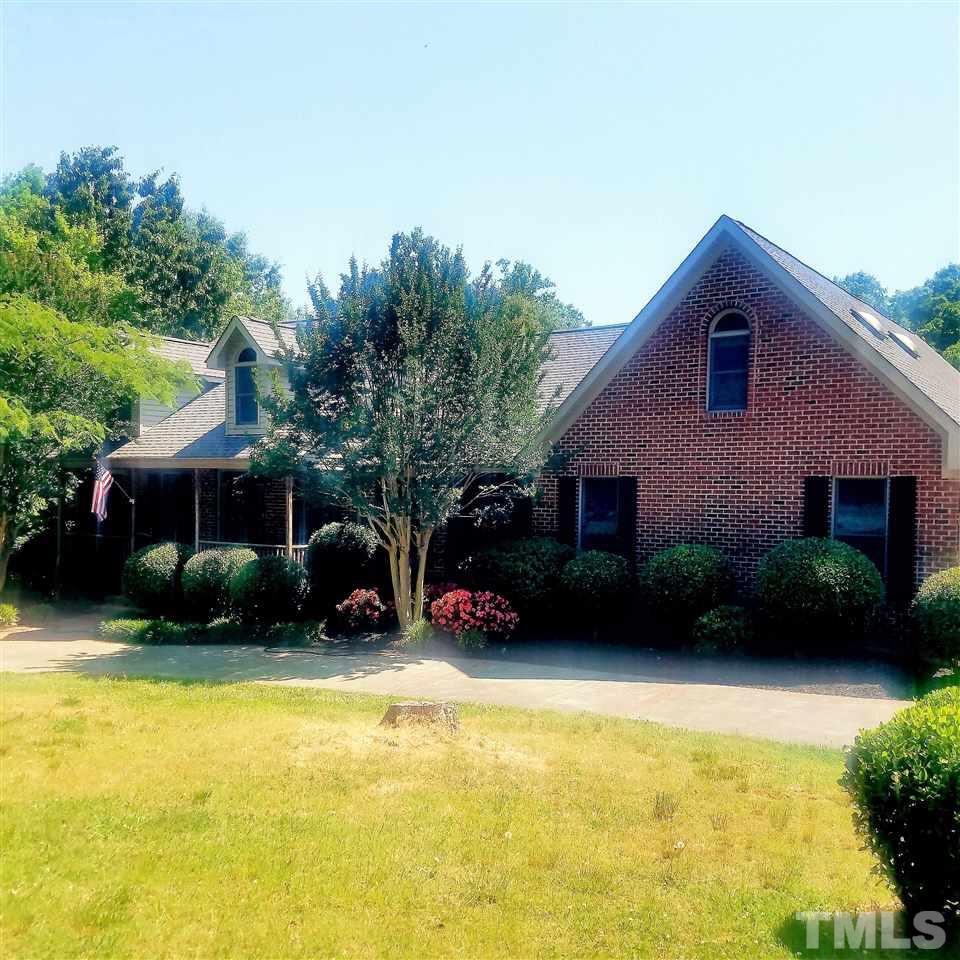 12804 Summerwind Trail Rougemont, NC 27572 - Photo 1 of 27 a view of a house with a garden