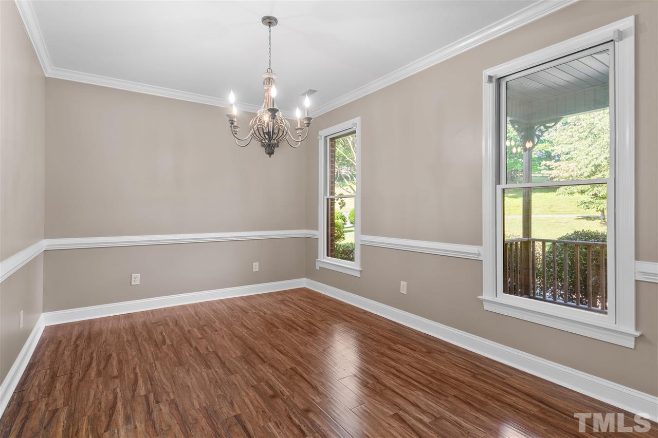 12804 Summerwind Trail Rougemont, NC 27572 - Photo 11 of 27 a view of an empty room with wooden floor and a window
