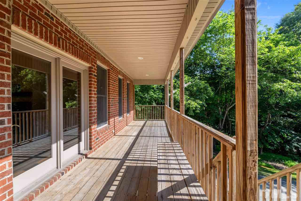 12804 Summerwind Trail Rougemont, NC 27572 - Photo 18 of 27 a view of balcony with wooden floor and fence