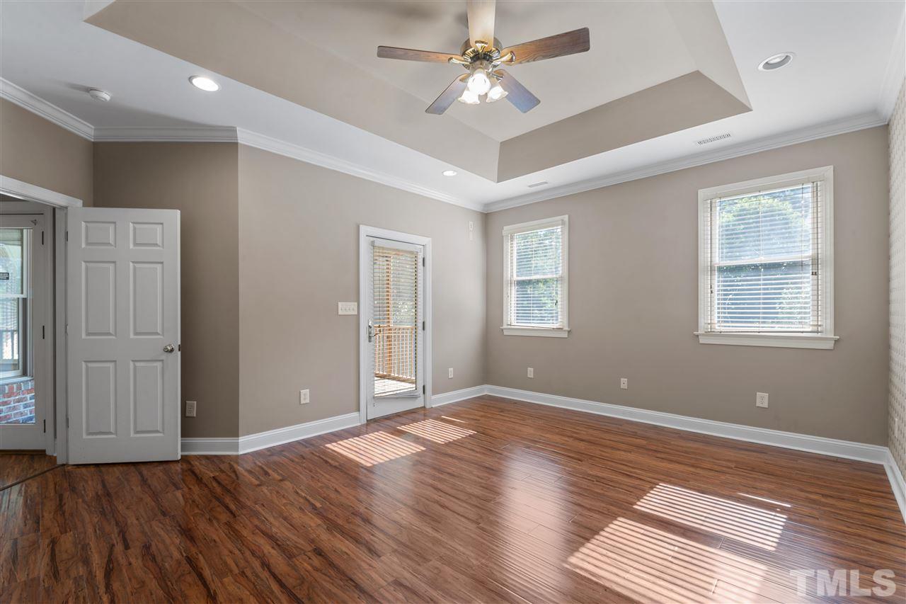 12804 Summerwind Trail Rougemont, NC 27572 - Photo 20 of 27 a view of an empty room with wooden floor and a window