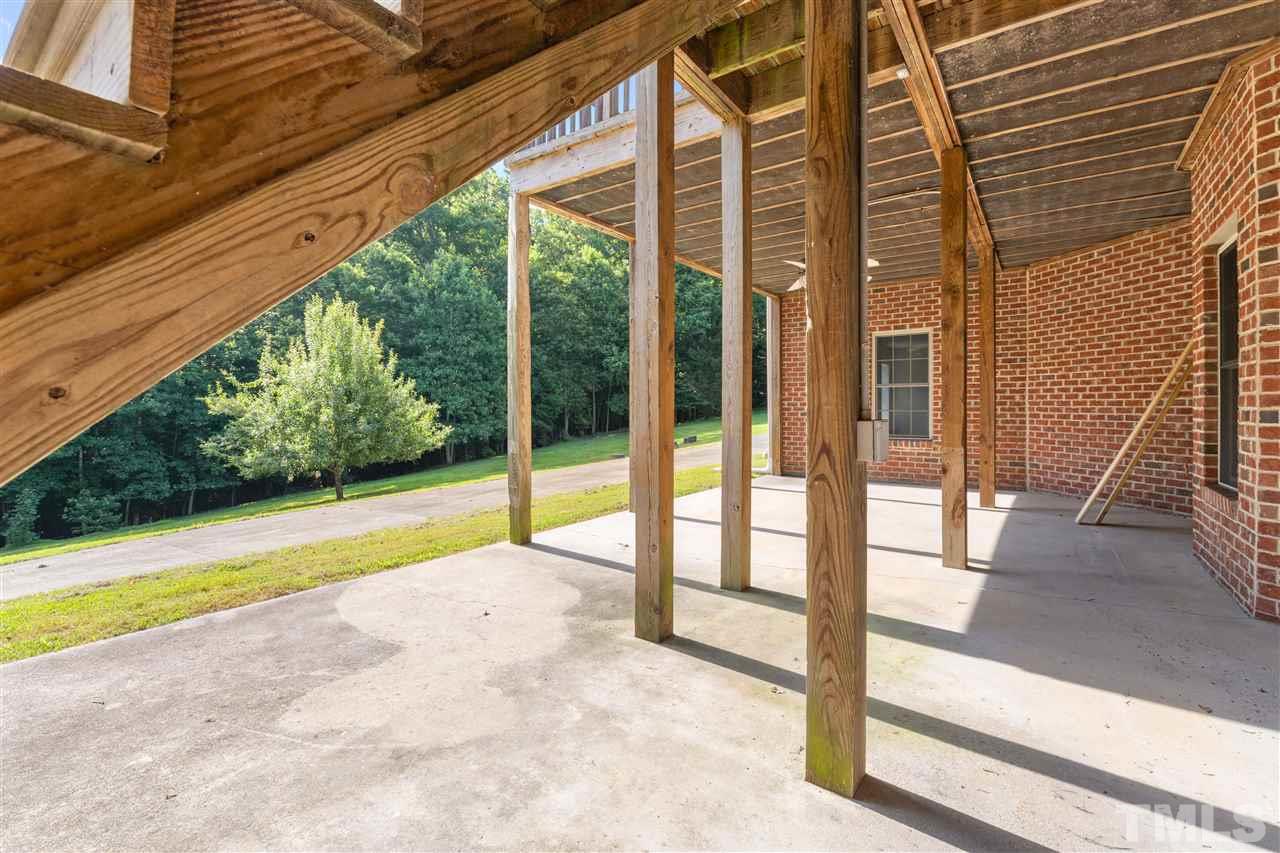 12804 Summerwind Trail Rougemont, NC 27572 - Photo 27 of 27 a view of swimming pool with porch and red chairs