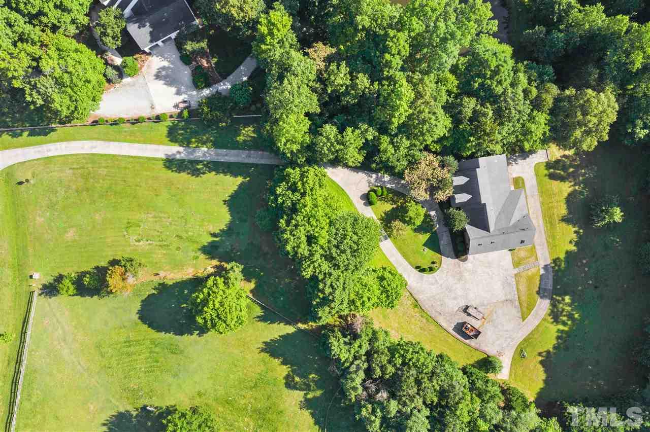 12804 Summerwind Trail Rougemont, NC 27572 - Photo 4 of 27 an aerial view of a house with yard swimming pool and outdoor seating
