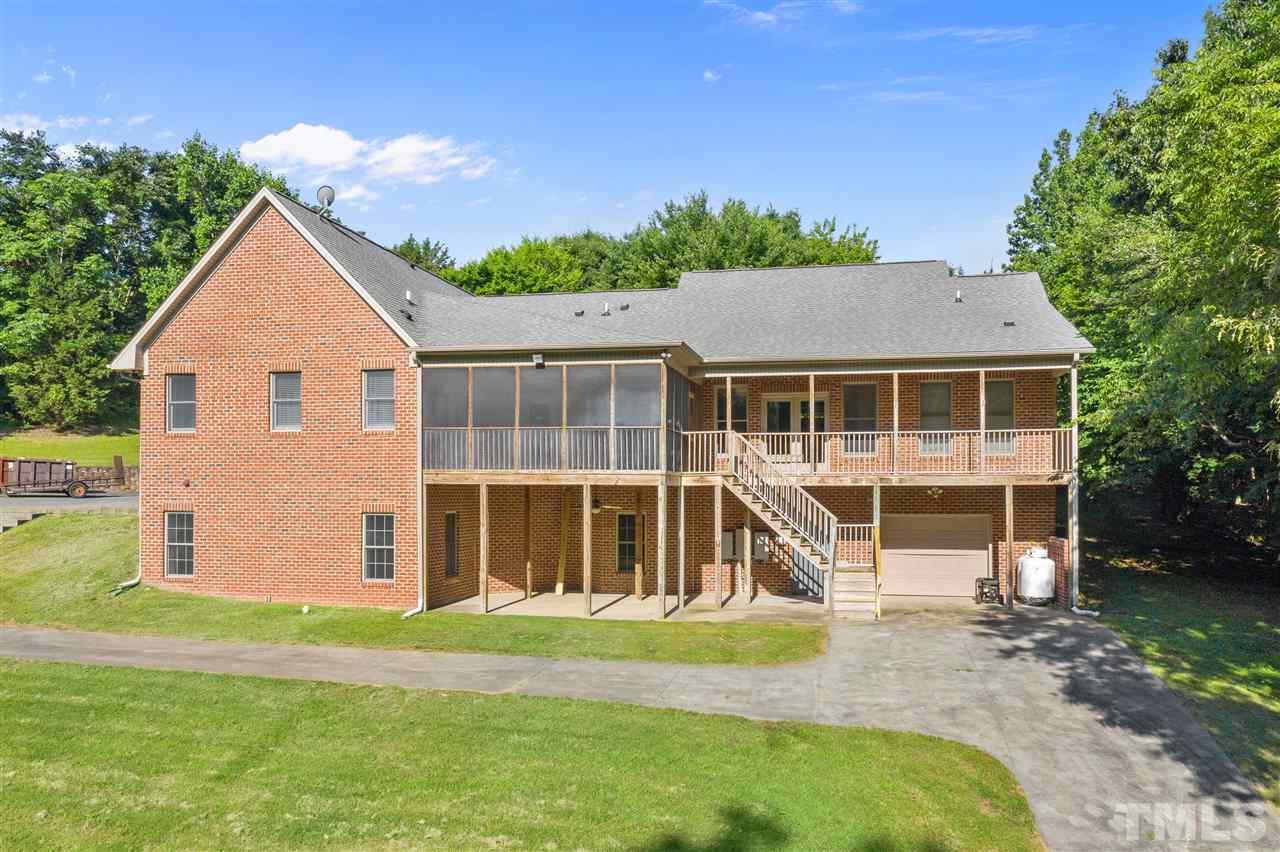 12804 Summerwind Trail Rougemont, NC 27572 - Photo 8 of 27 a view of a house with a yard and sitting area