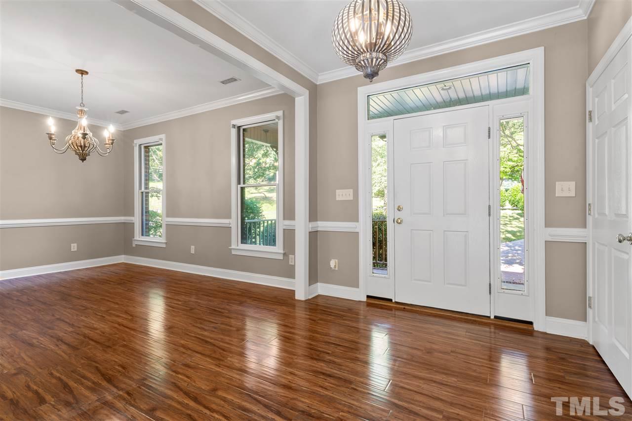 12804 Summerwind Trail Rougemont, NC 27572 - Photo 10 of 27 a view of a livingroom with wooden floor and a large window