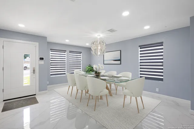 a view of a dining room with furniture and window